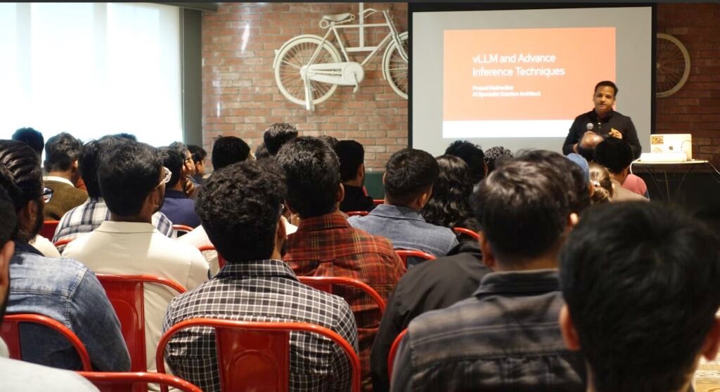 Speaker presenting inference techniques to an audience at an InferenceOps community meetup.